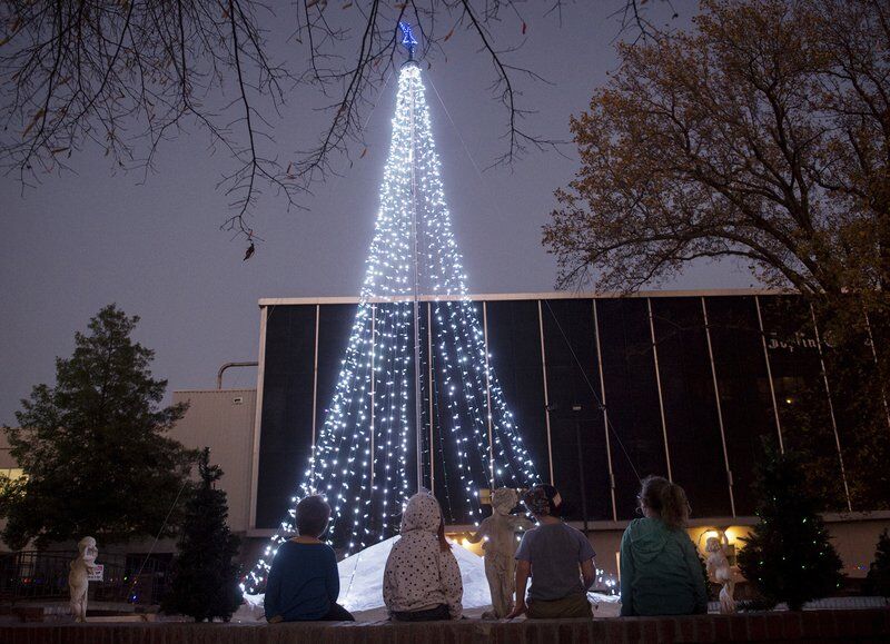Subdued ceremony's lights still draw a crowd